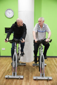 image showing two prehab4cancer participants on exercise bikes