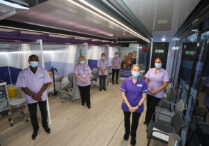 6 clinical trials nurses line up inside the NHS Galleri trial unit