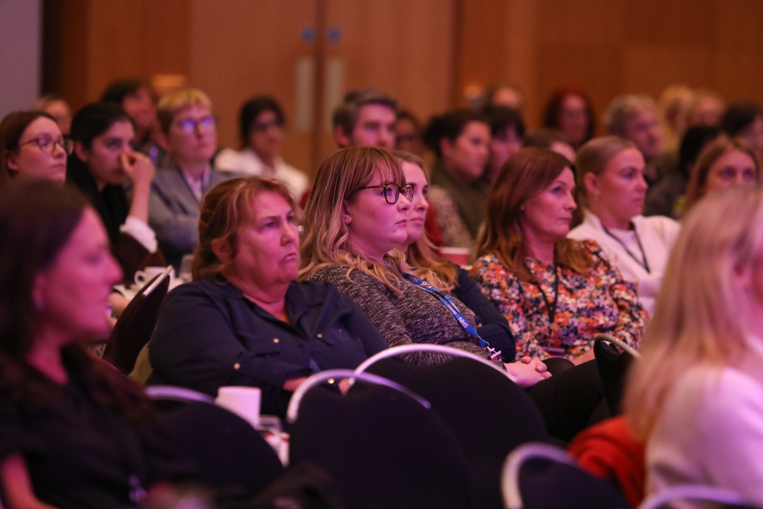 Audience members watch te stage at Greater Manchester Cancer Conference 2022