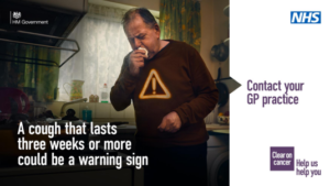 A white man coughing in a kitchen wearing a red jumper with a warning exclamation mark sign on it. Words: A cough that lasts more than three weeks could be a warning sign