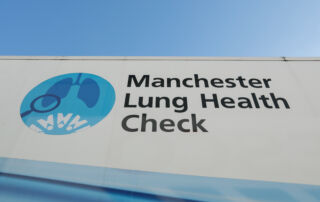 The side of a truck with the words the Manchester Lung Health Check