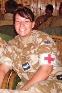 Dawn Turner in military uniform with a red cross on her arm