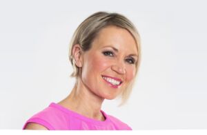 The late Dianne Oxberry a white woman with short blonde hair wearing a pink top