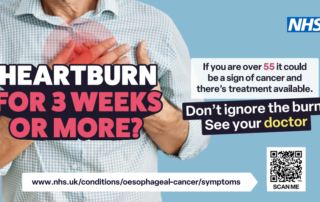 A man in his late 55s wearing a checked shirt holds his hand to his chest to illustrate the area where you might feel heartburn. The words Heartburn 3 weeks or more? are emblazoned across his chest. To the side are the NHS logo and the words: If you are over 55 it could be a sign of cancer and there's treatment available. Don't ignore the burn. See you doctor. There is also a link tot he NHS symptoms website www.nhs.uk/conditions/oesophageal-cancer/symptomsand a OR code.