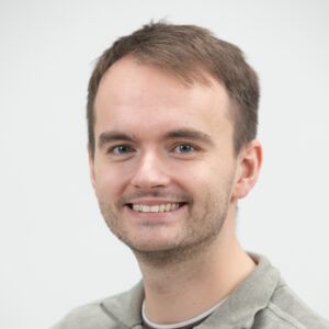 Oliver Butterworth head and shoulders shot a white man with short brown hair