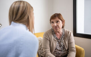An older white woman talking to a counsellor as part of NHS Talking Therapy