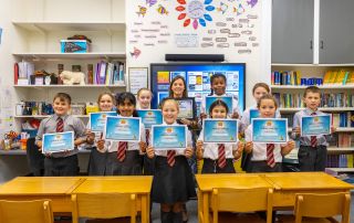 Primary schools children with a certificate after becoming 'sun safe' schools