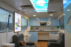 A colourful and friendly treatment room on board the mobile cancer care unit