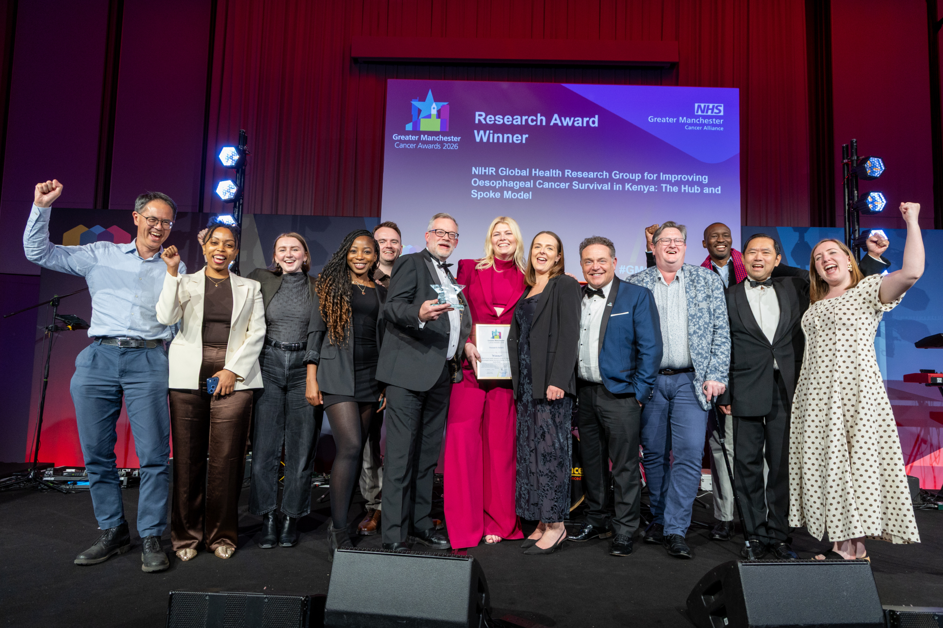 People on stage with an award