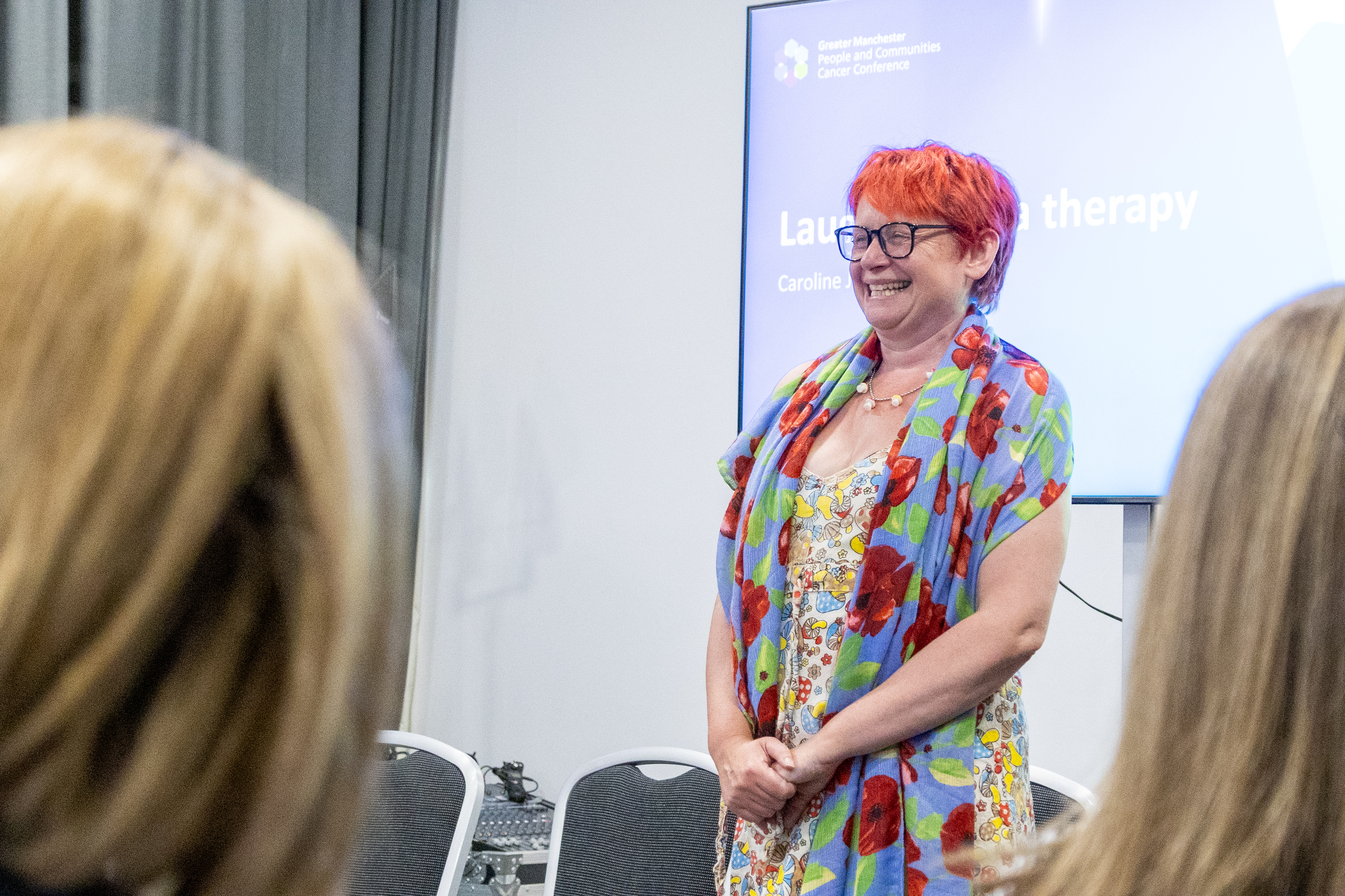 35 Close up of Caroline Jones smiling at delegates after finishing a laughter yoga therapy session