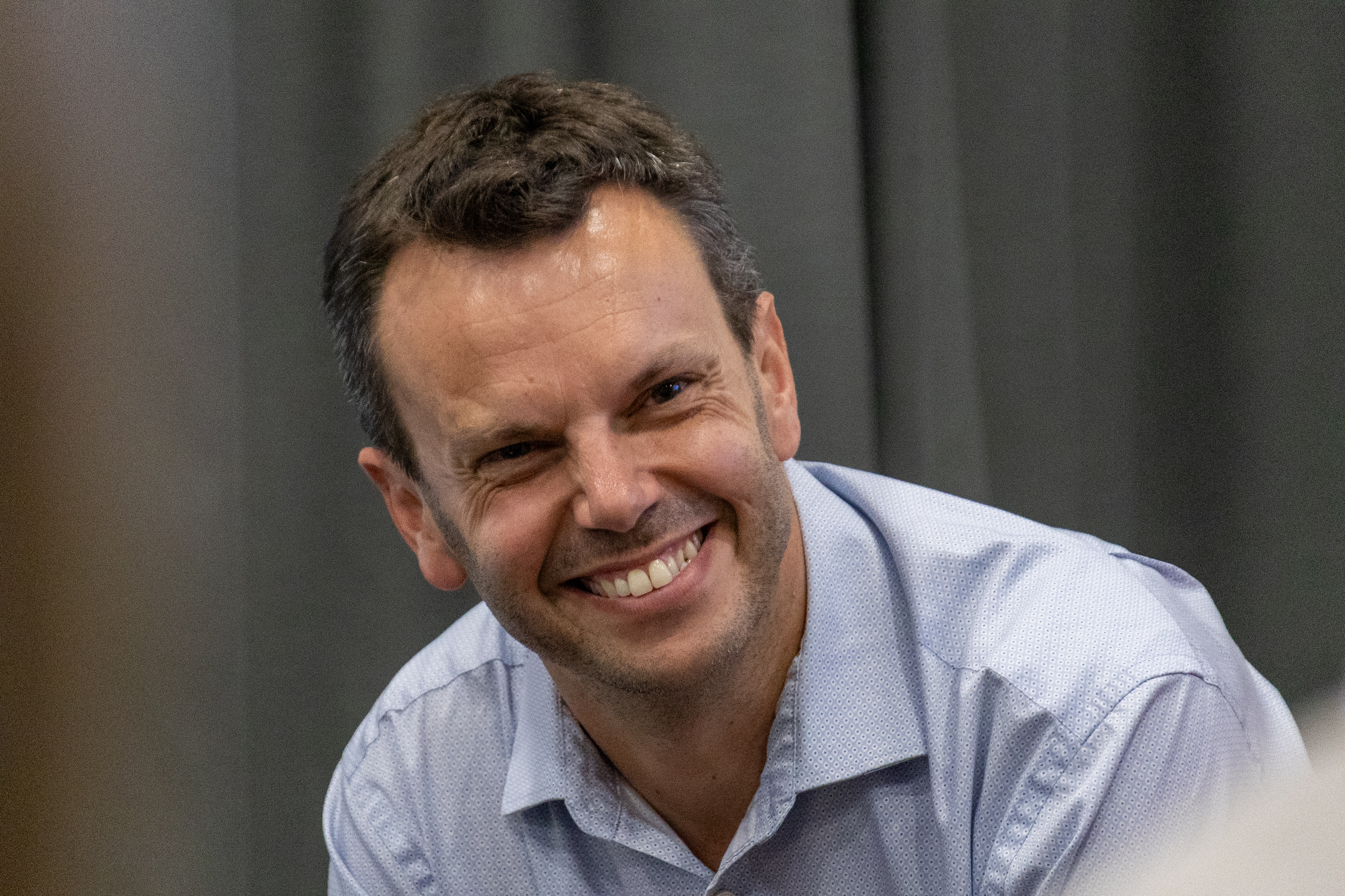 43 Close up of Tom Thornber sat on a Q&A panel smiling